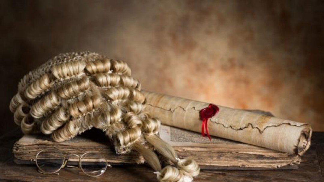 Barrister barred for practising without certificate